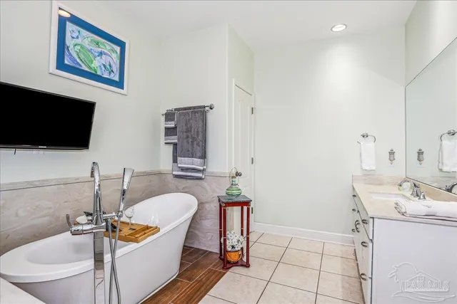 a utility room with granite countertop a sink a washer and dryer