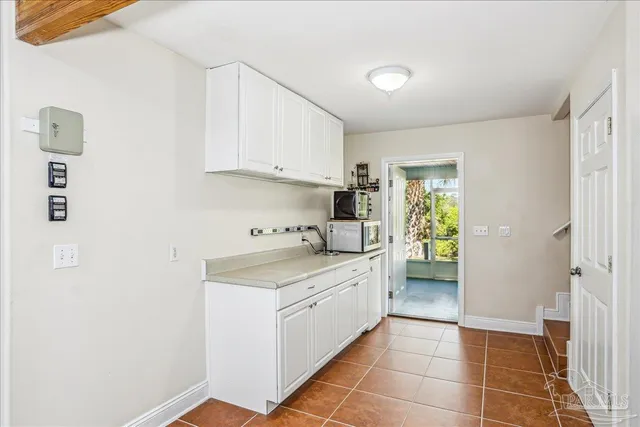 an aerial view of residential houses with city view
