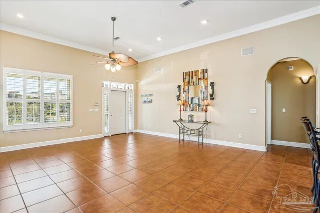a spacious bedroom with a bed and window