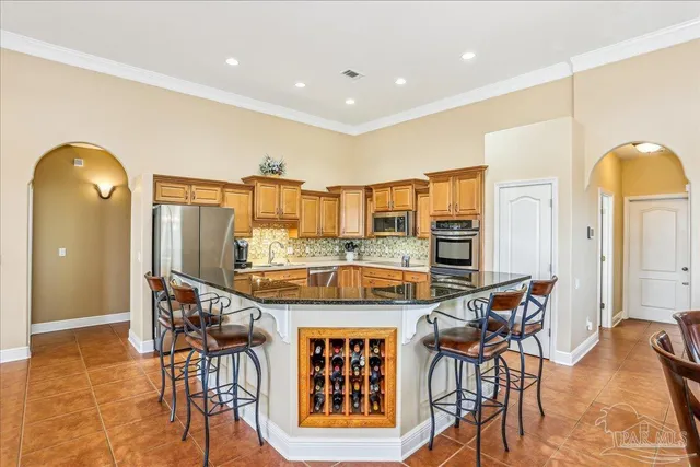 a spacious bathroom with a double vanity sink a mirror a bathtub and next to a window