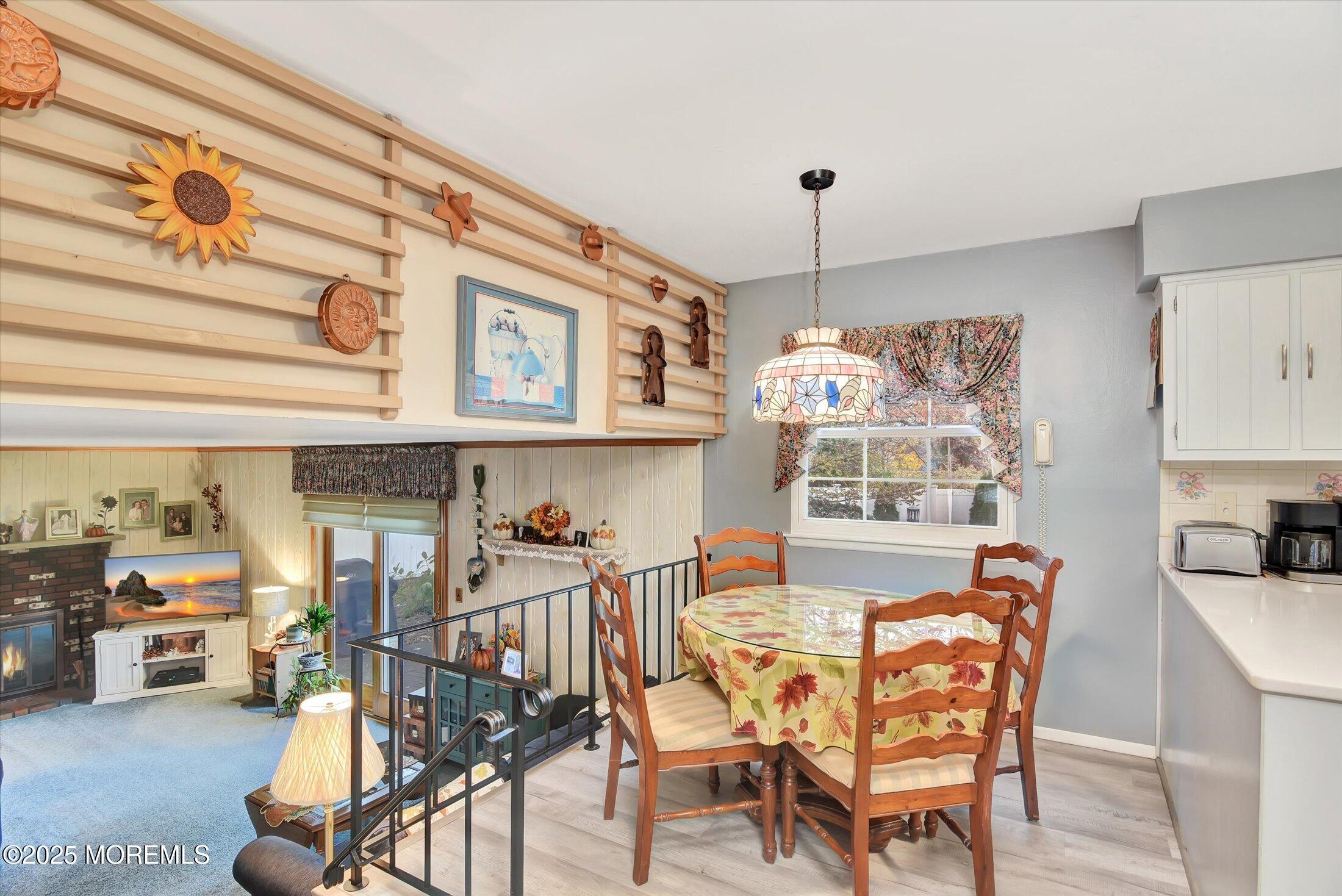 7 Nantucket Court Howell, NJ 07731 - Photo 13 of 39 a view of a dining room with furniture and chandelier