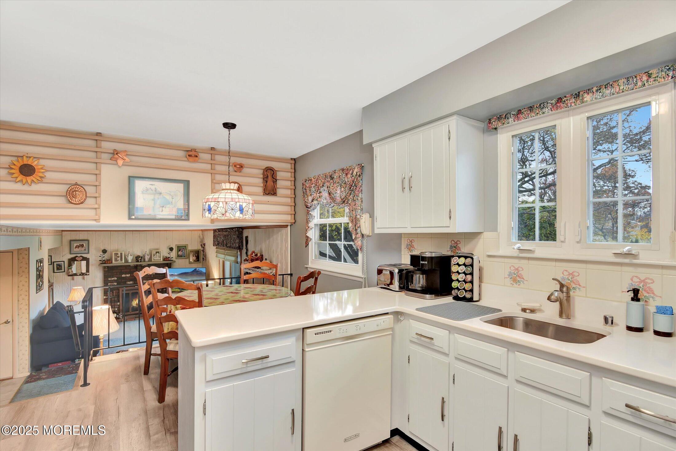 7 Nantucket Court Howell, NJ 07731 - Photo 15 of 39 a view of center kitchen island a sink a table and chairs