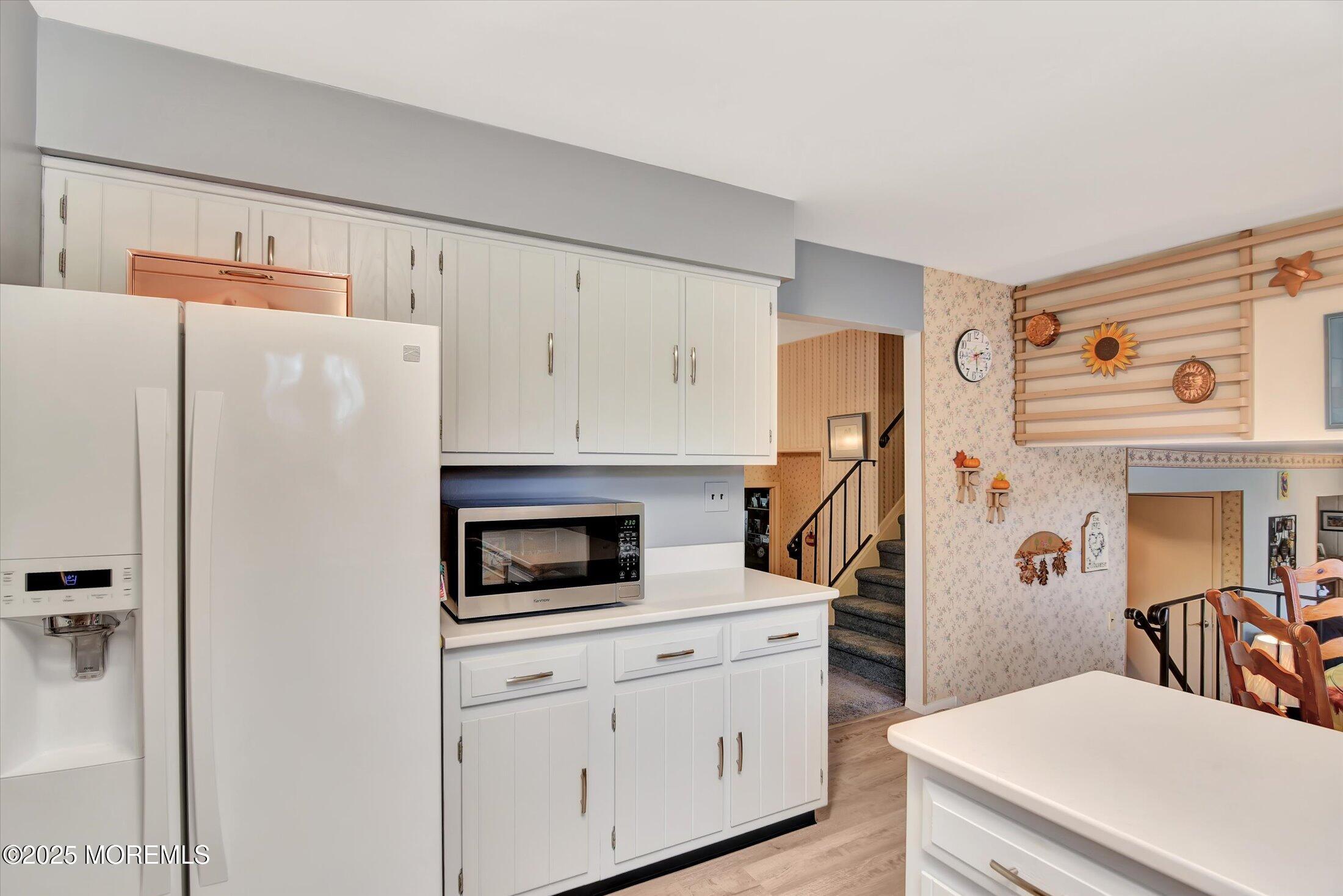 7 Nantucket Court Howell, NJ 07731 - Photo 16 of 39 a kitchen with stainless steel appliances a refrigerator sink and cabinets