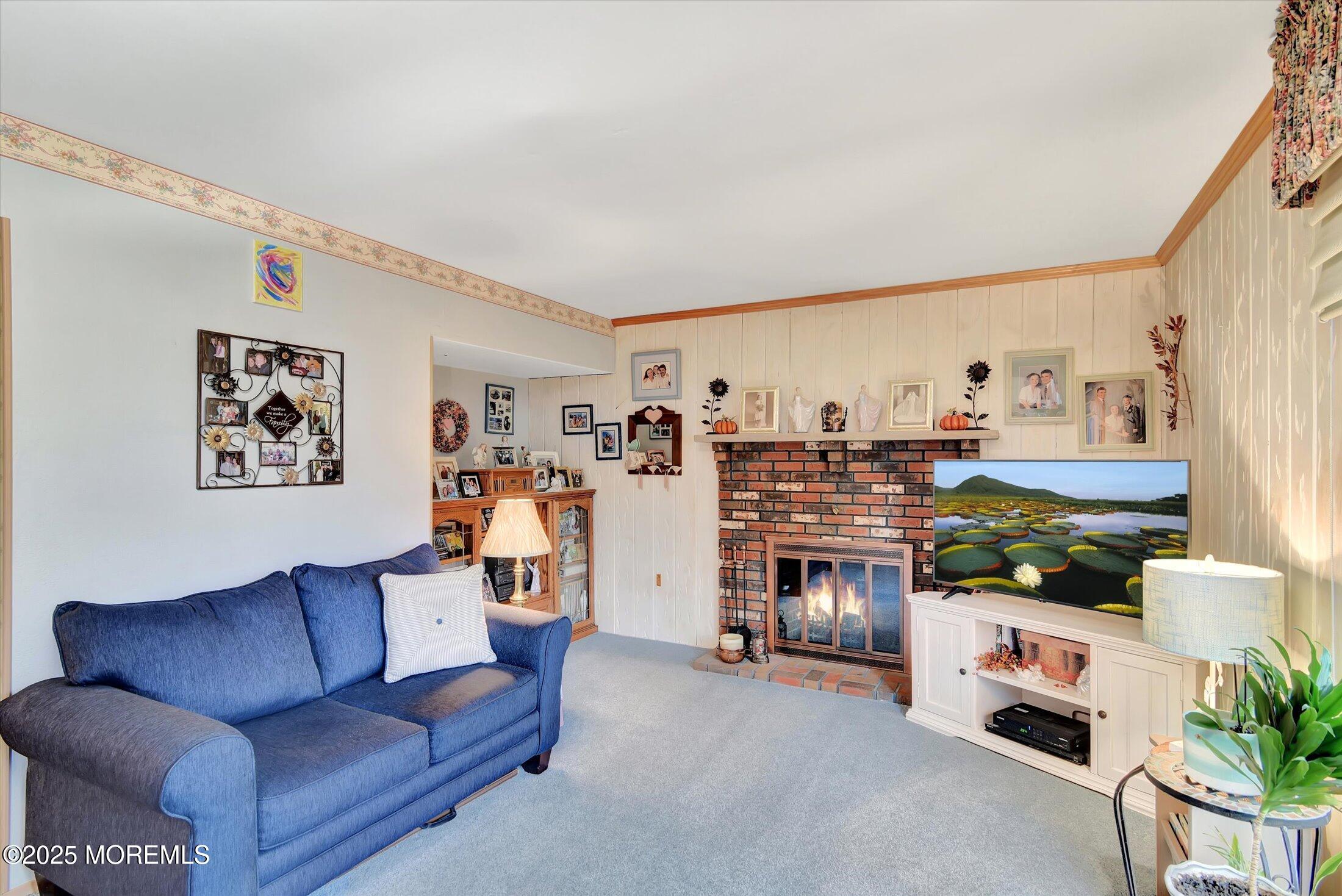 7 Nantucket Court Howell, NJ 07731 - Photo 18 of 39 a living room with furniture and a fireplace