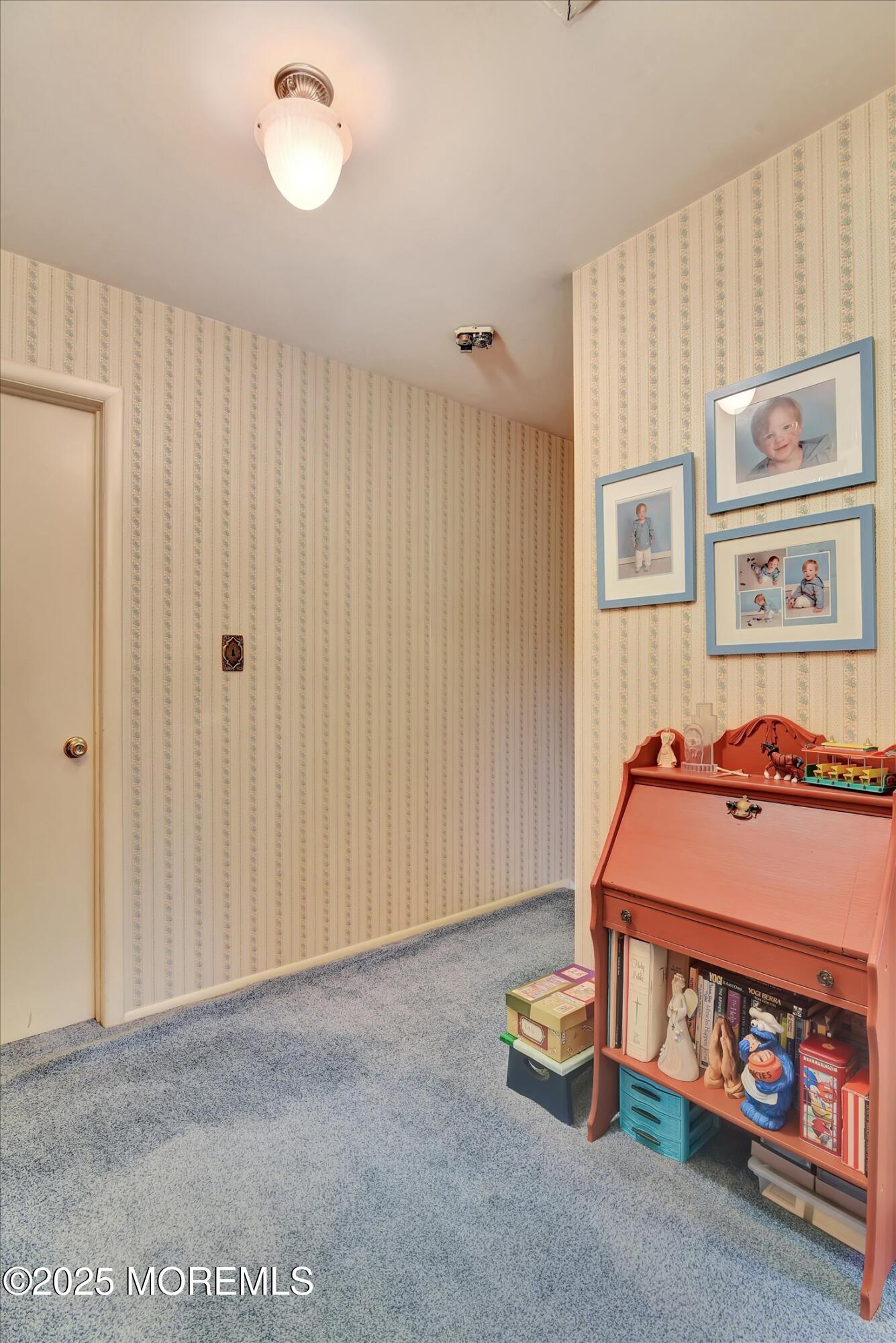 7 Nantucket Court Howell, NJ 07731 - Photo 22 of 39 a room with toys and a chandelier