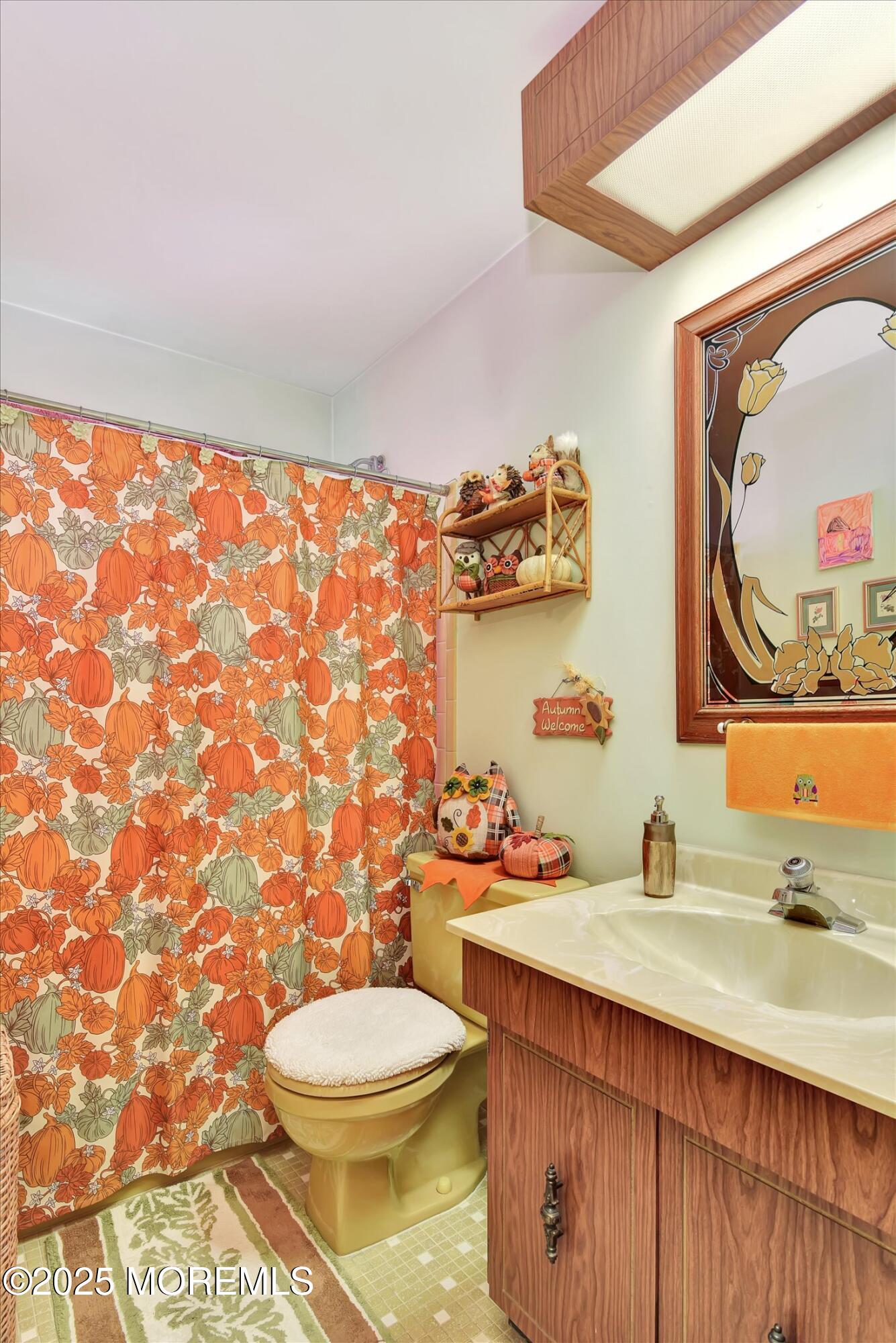 7 Nantucket Court Howell, NJ 07731 - Photo 23 of 39 a bathroom with a sink a toilet and mirror