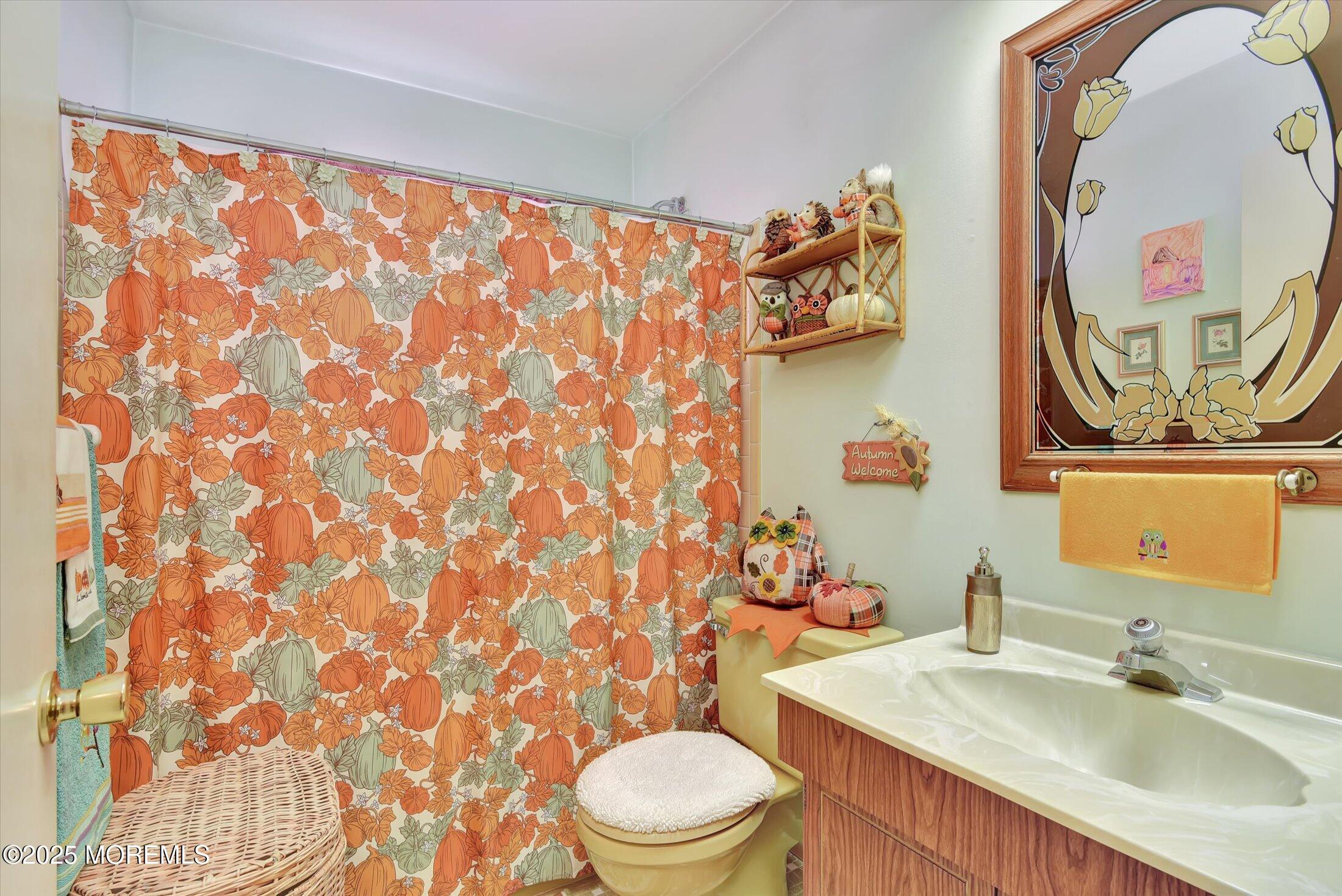 7 Nantucket Court Howell, NJ 07731 - Photo 24 of 39 a bathroom with a sink a toilet and a mirror