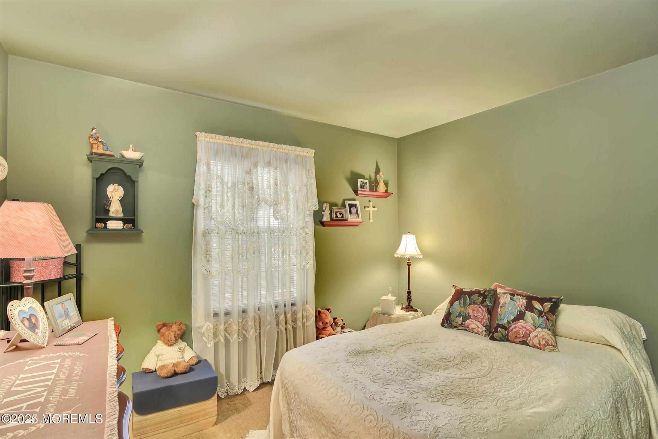 7 Nantucket Court Howell, NJ 07731 - Photo 25 of 39 a bedroom with a bed and a lamp