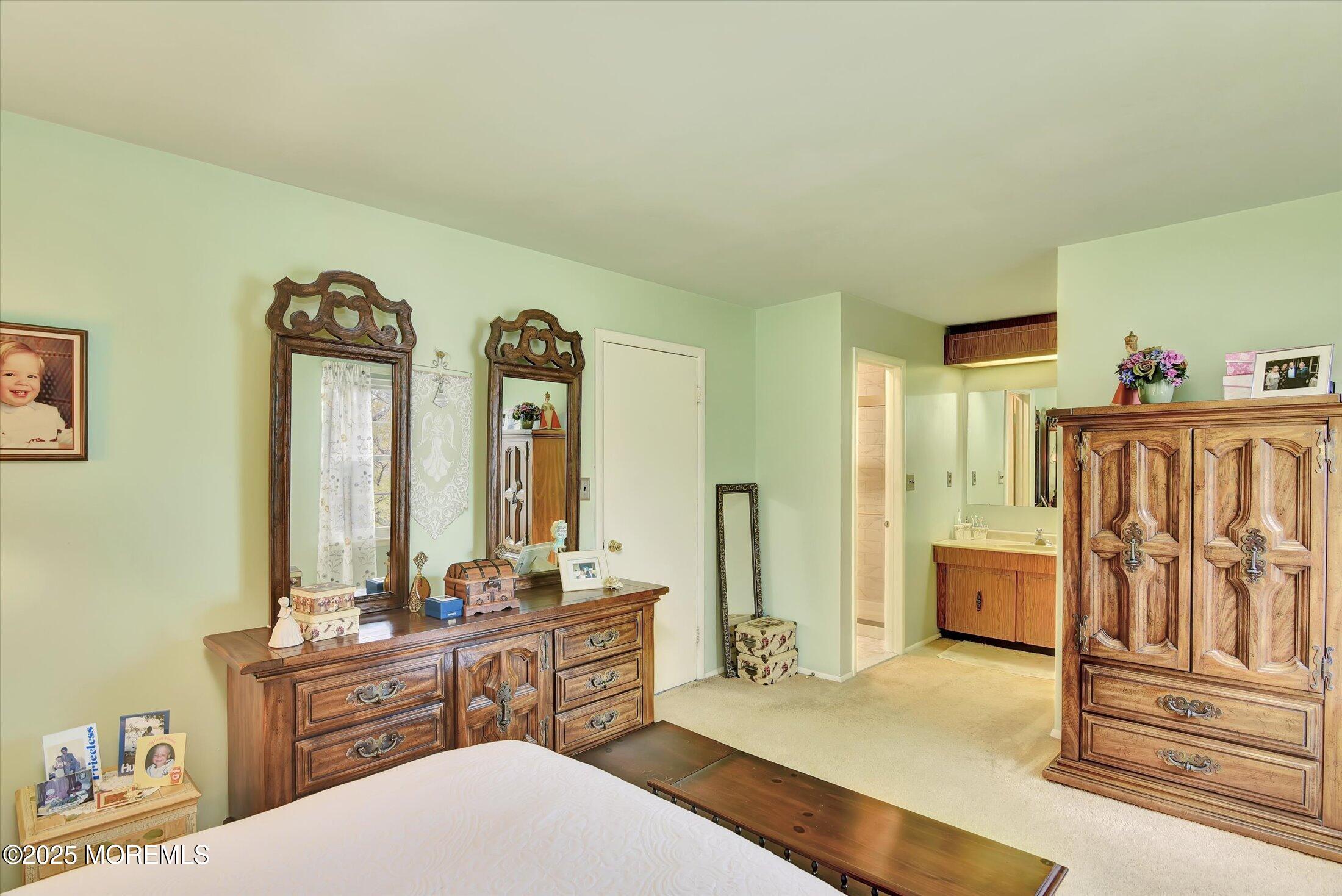 7 Nantucket Court Howell, NJ 07731 - Photo 28 of 39 a spacious bathroom with a bathtub a sink and a mirror