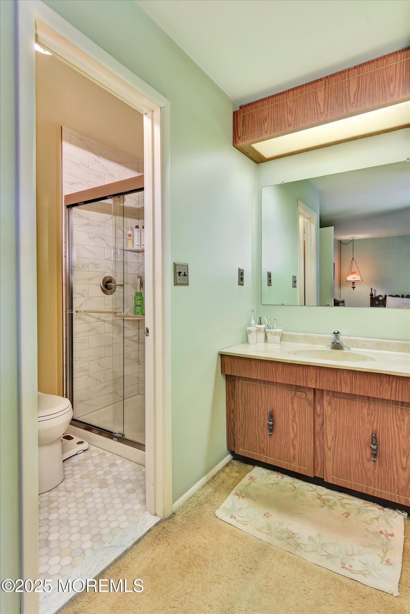 7 Nantucket Court Howell, NJ 07731 - Photo 29 of 39 a bathroom with a sink a toilet and shower