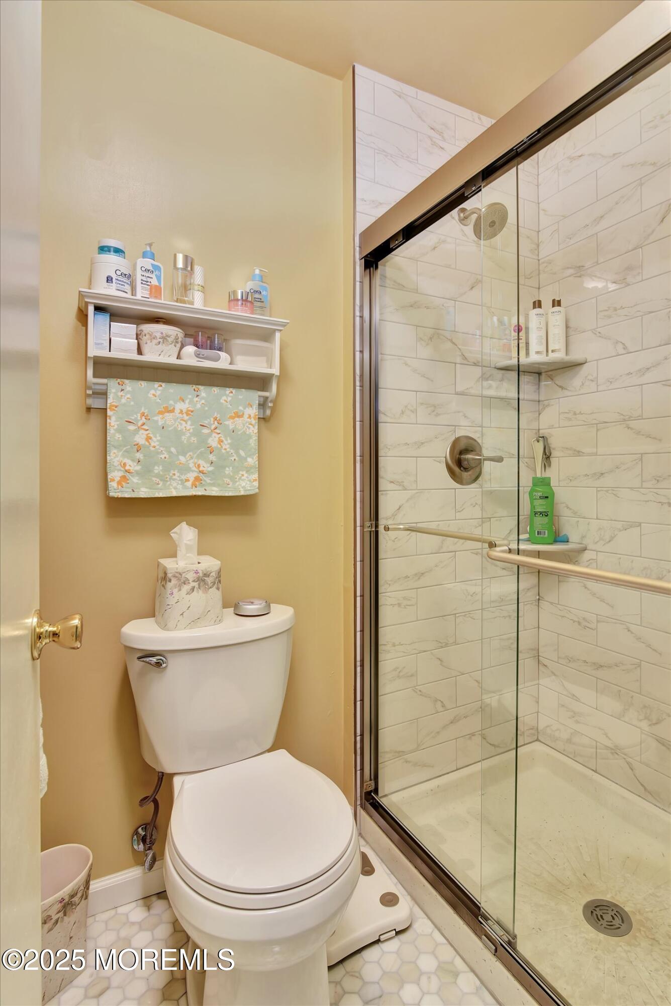7 Nantucket Court Howell, NJ 07731 - Photo 30 of 39 a bathroom with a toilet a sink and a shower