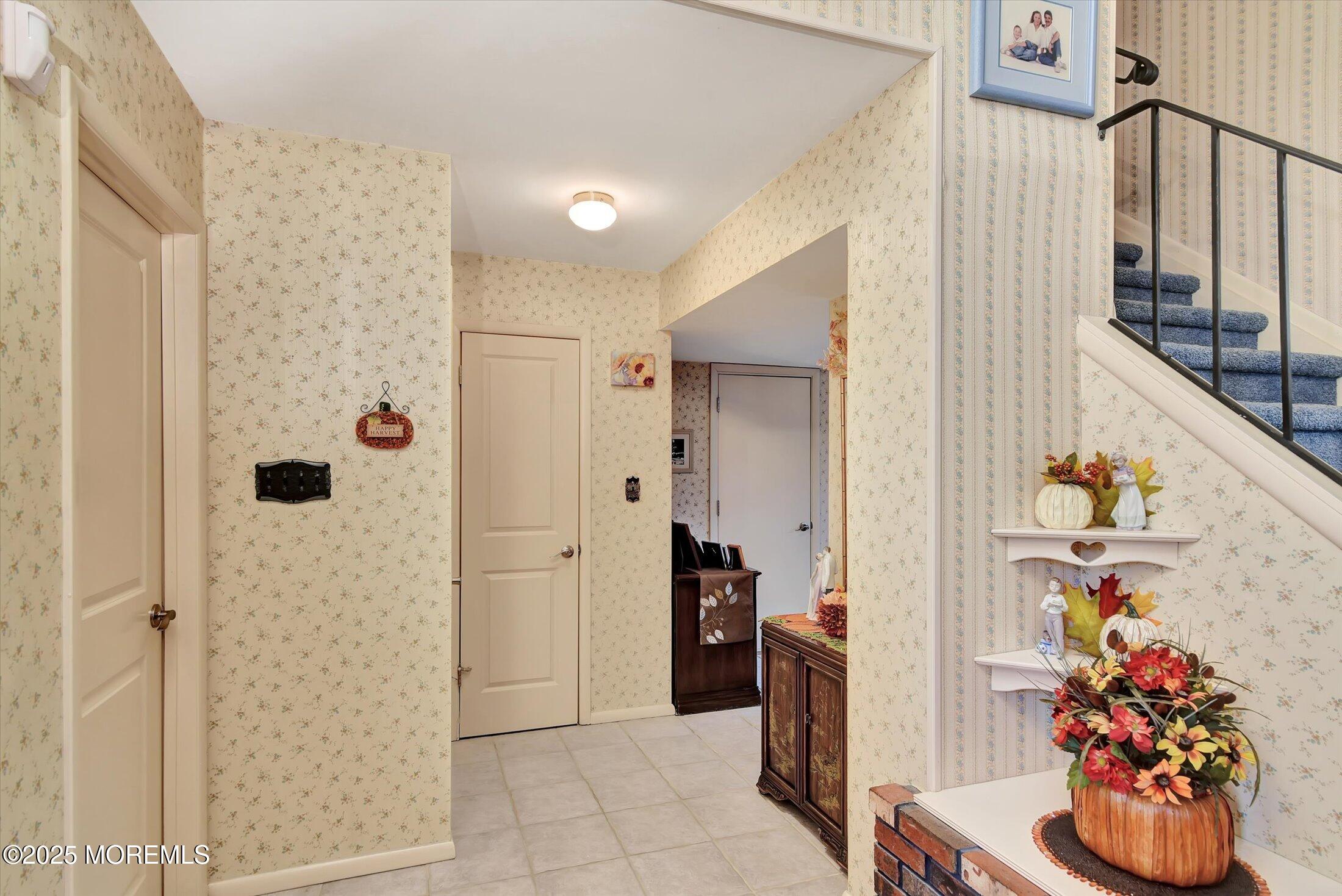 7 Nantucket Court Howell, NJ 07731 - Photo 3 of 39 a view of a hallway with front door and wooden floor