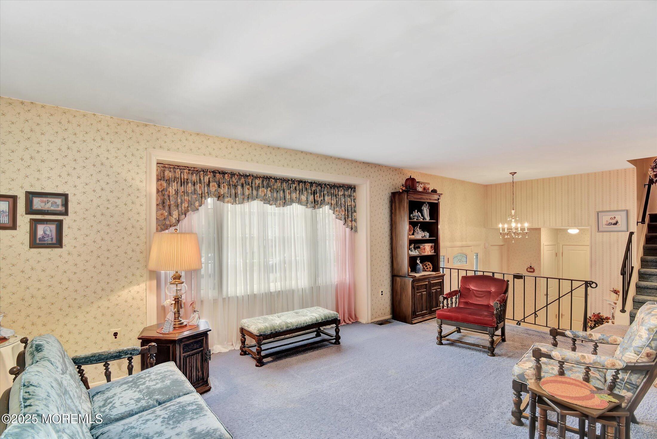 7 Nantucket Court Howell, NJ 07731 - Photo 7 of 39 a living room with furniture and a table