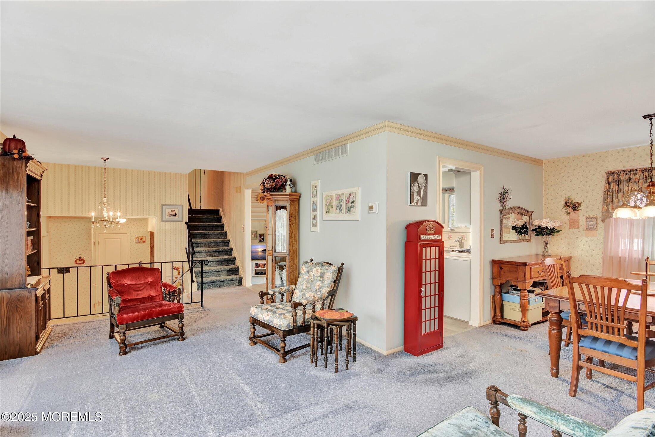 7 Nantucket Court Howell, NJ 07731 - Photo 8 of 39 a living room with furniture and a gym machine