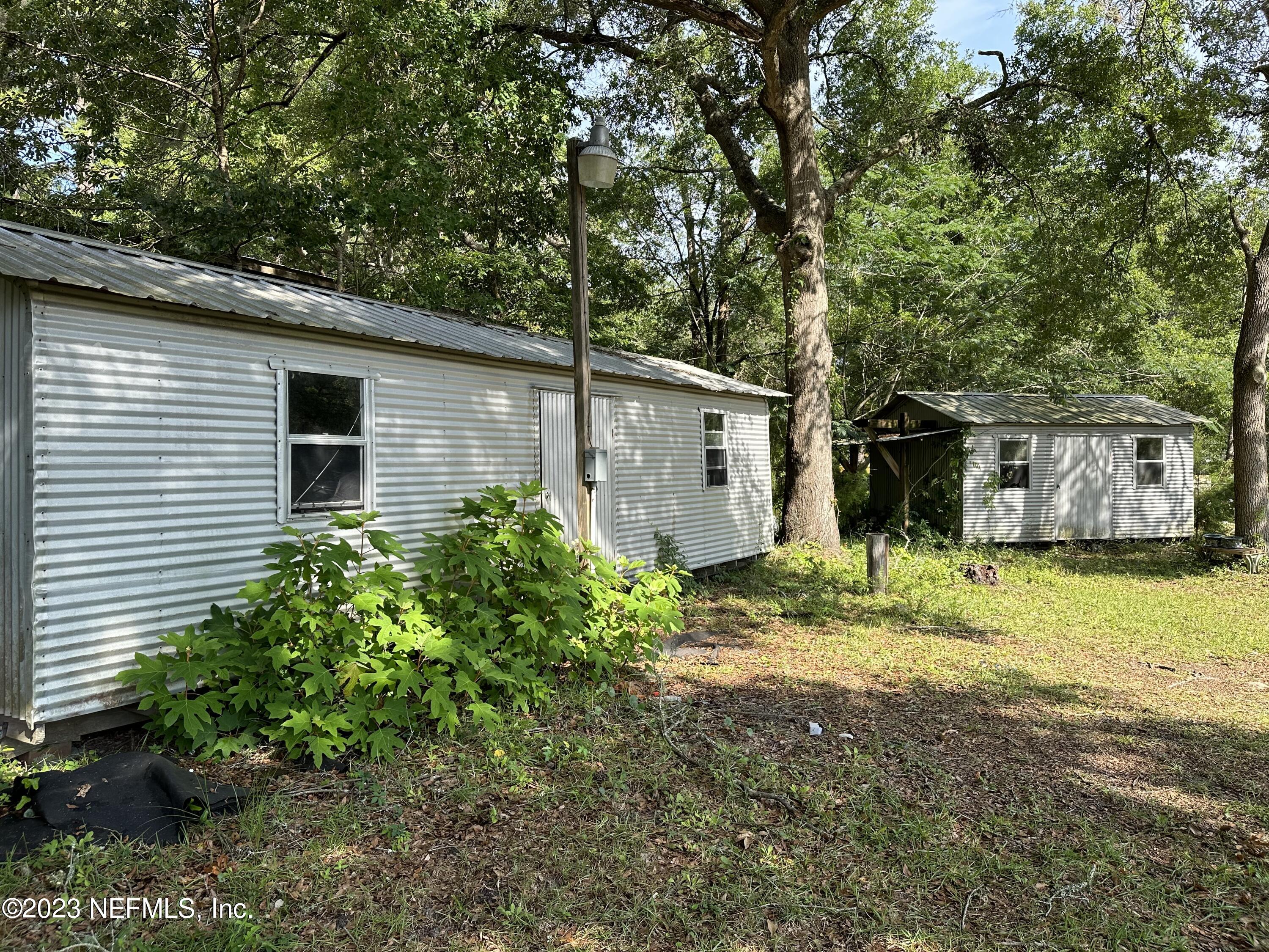 85713 Kirkland Road Yulee, FL 32097 - Photo 4 of 23 Sheds Back Yard