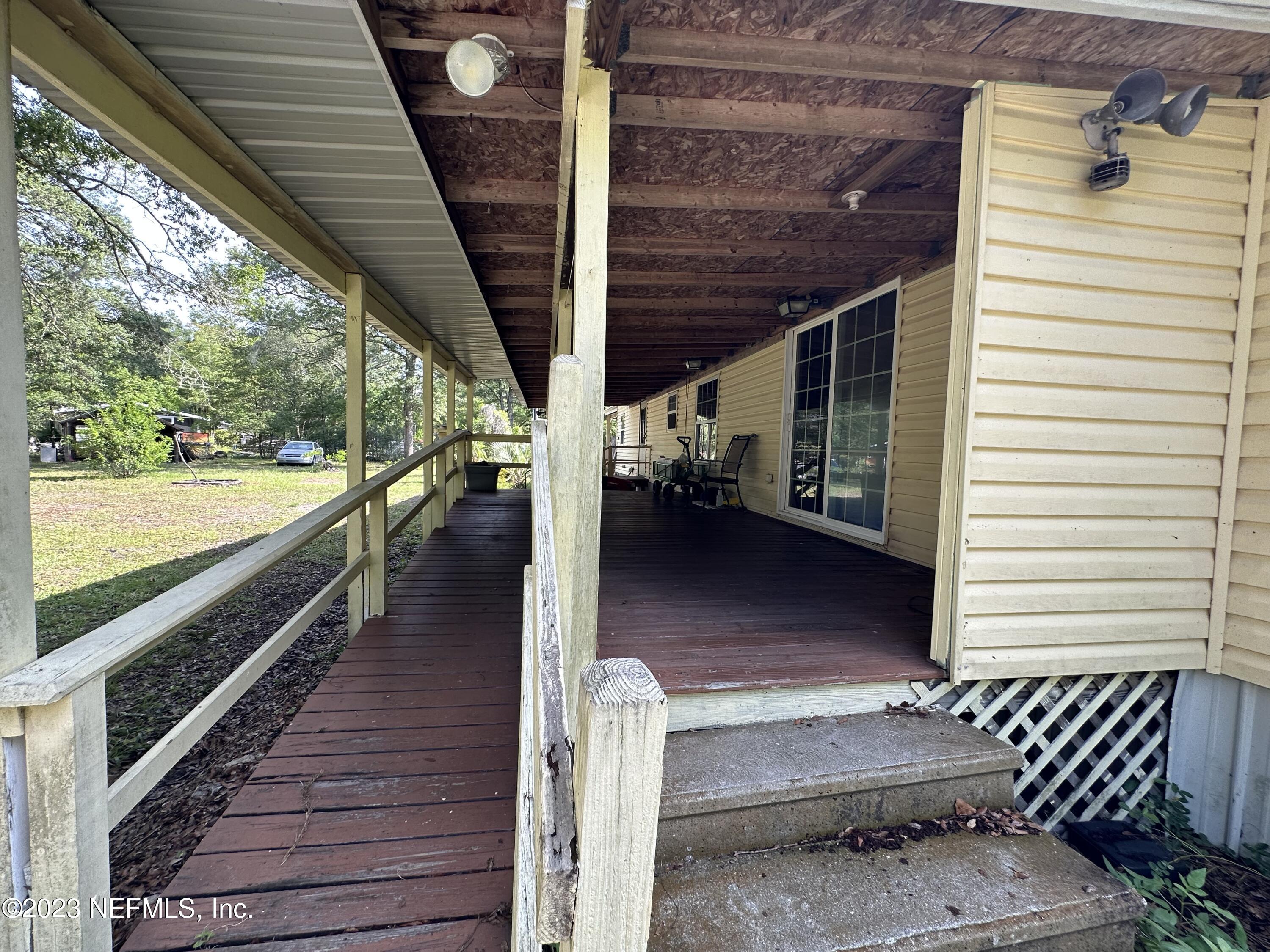 85713 Kirkland Road Yulee, FL 32097 - Photo 9 of 23 Back Covered Porch