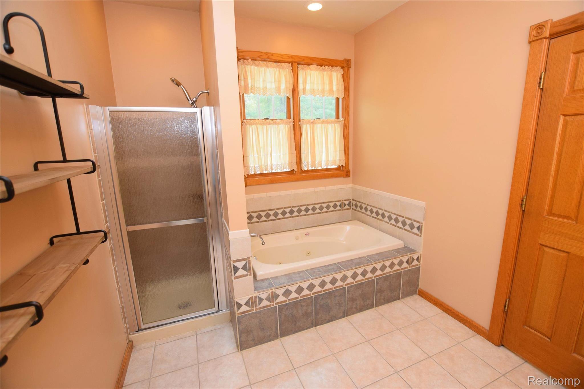 12982 Ithaca Road St. Charles, MI 48655 - Photo 16 of 27 Master Bath tub and shower