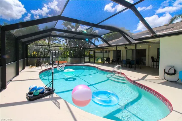 a view of a swimming pool with a patio