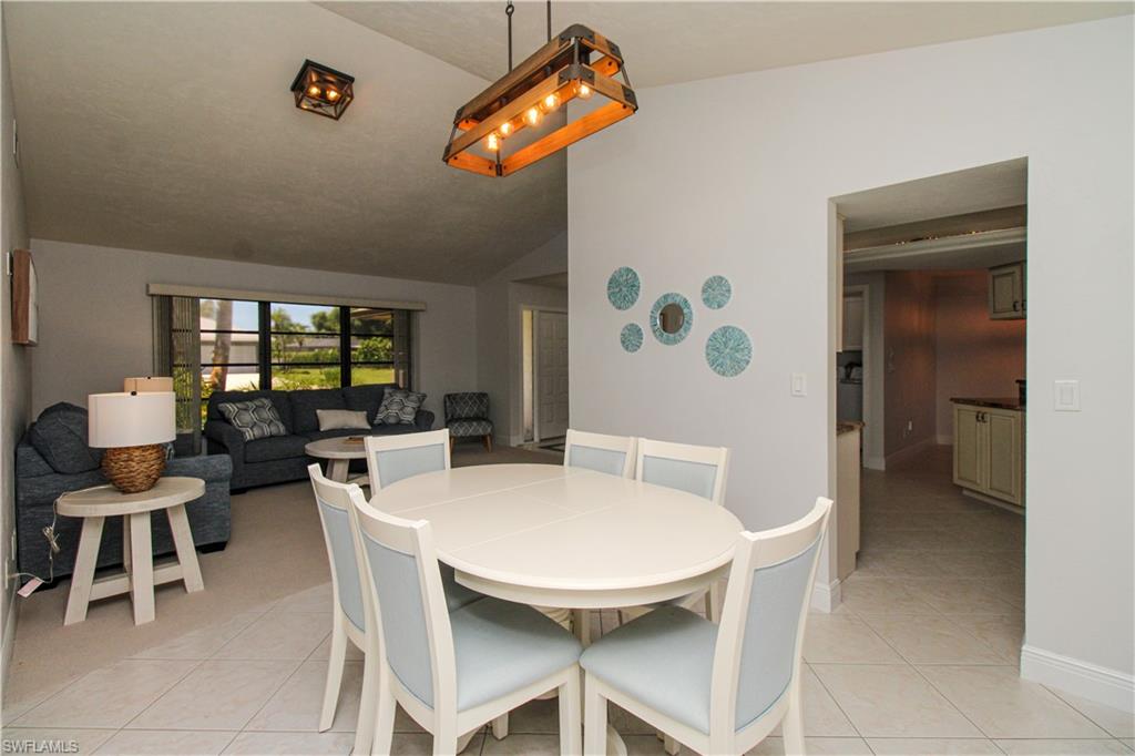 213 Bay Meadows Drive Naples, FL 34113 - Photo 17 of 50 a view of a dining room with furniture