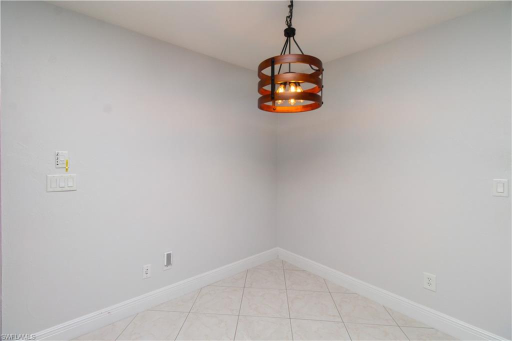 213 Bay Meadows Drive Naples, FL 34113 - Photo 40 of 50 a view of a small space with racks on the wall