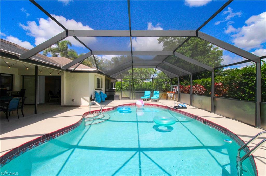 213 Bay Meadows Drive Naples, FL 34113 - Photo 41 of 50 a view of a backyard with a patio and a patio