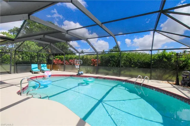 a view of a swimming pool with a patio