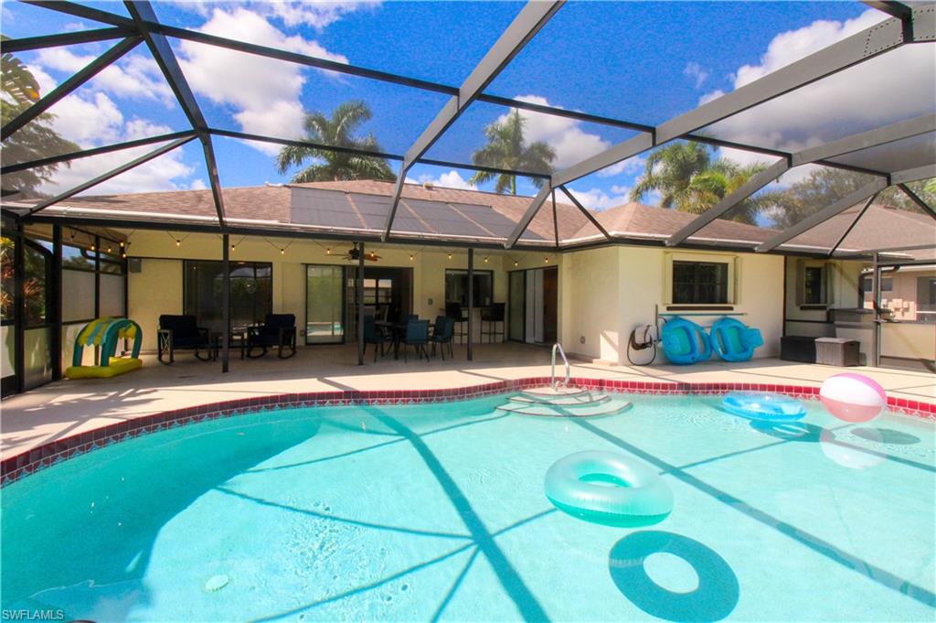 213 Bay Meadows Drive Naples, FL 34113 - Photo 45 of 50 a view of a swimming pool with a patio