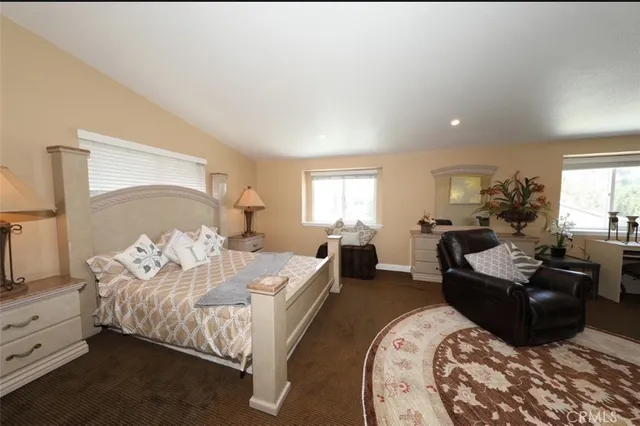 a bed room with bed and window