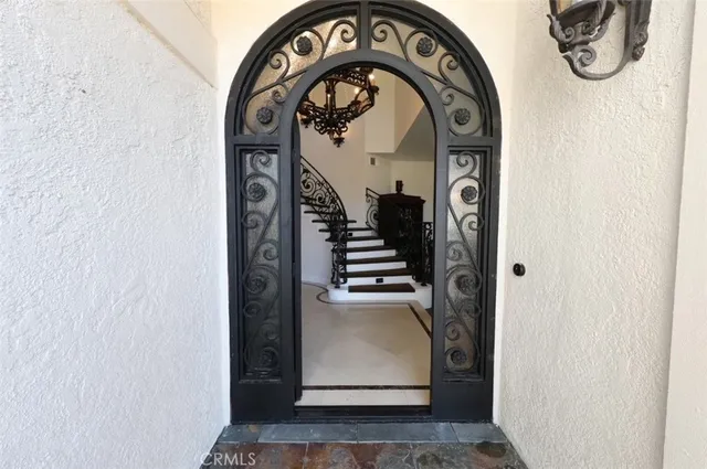 a view of a hallway with wooden walls