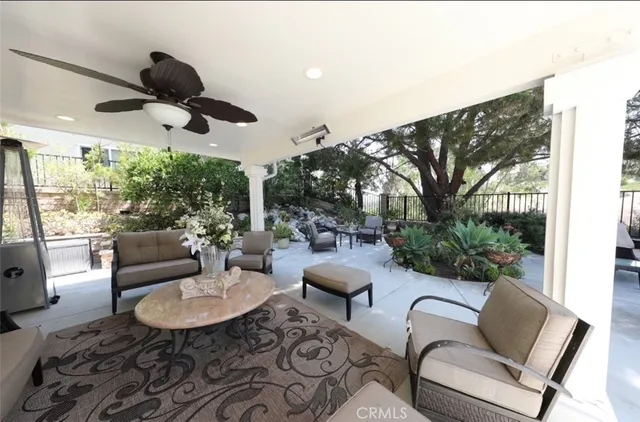 a outdoor space with patio couch and a large window
