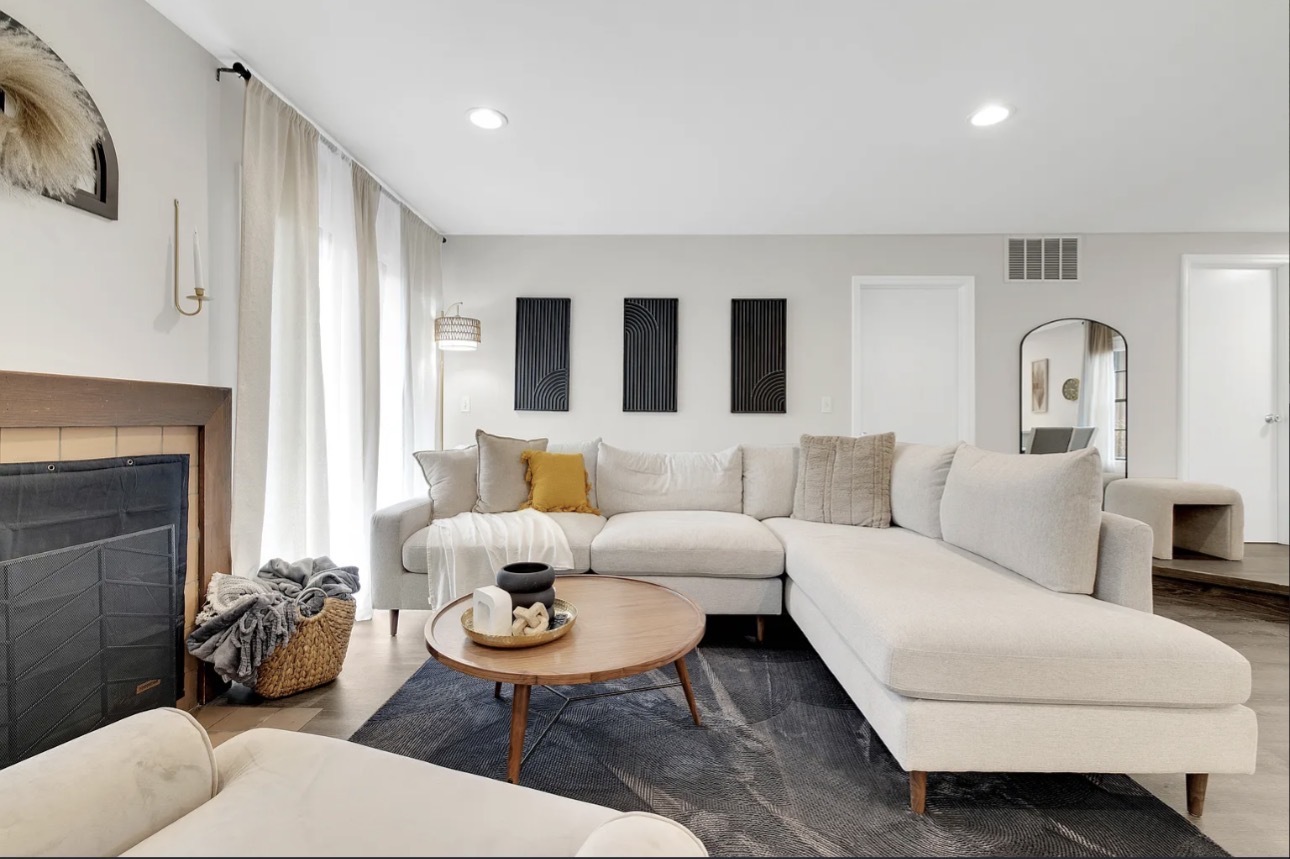 379 Sandhurst Circle, Unit 1 Glen Ellyn, IL 60137 - Photo 15 of 20 a living room with furniture and a fireplace