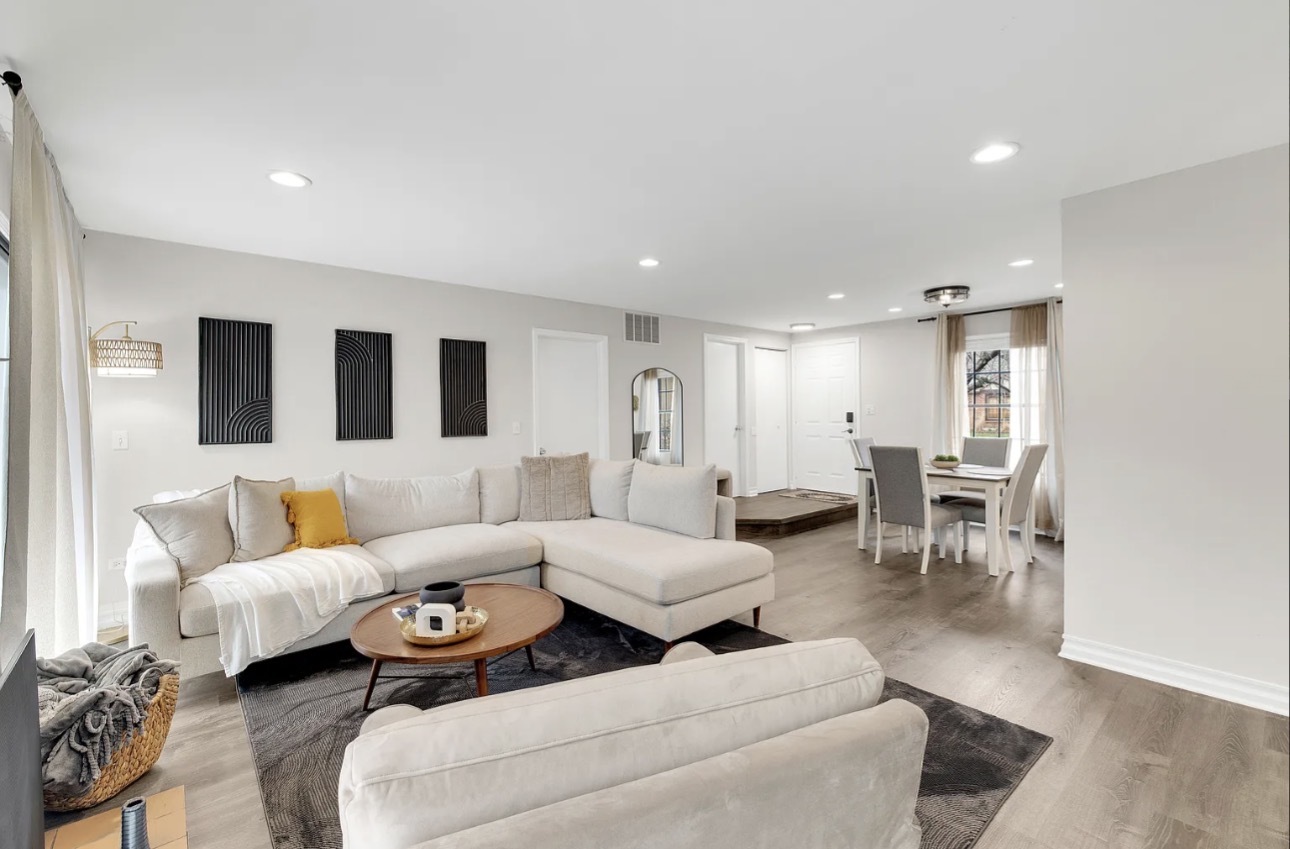 379 Sandhurst Circle, Unit 1 Glen Ellyn, IL 60137 - Photo 20 of 20 a living room with furniture and view of kitchen