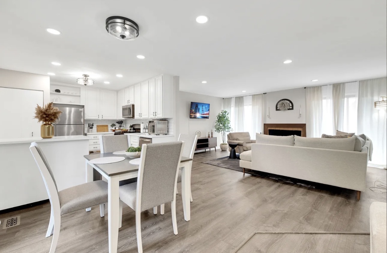 379 Sandhurst Circle, Unit 1 Glen Ellyn, IL 60137 - Photo 4 of 20 a living room with furniture and a wooden floor