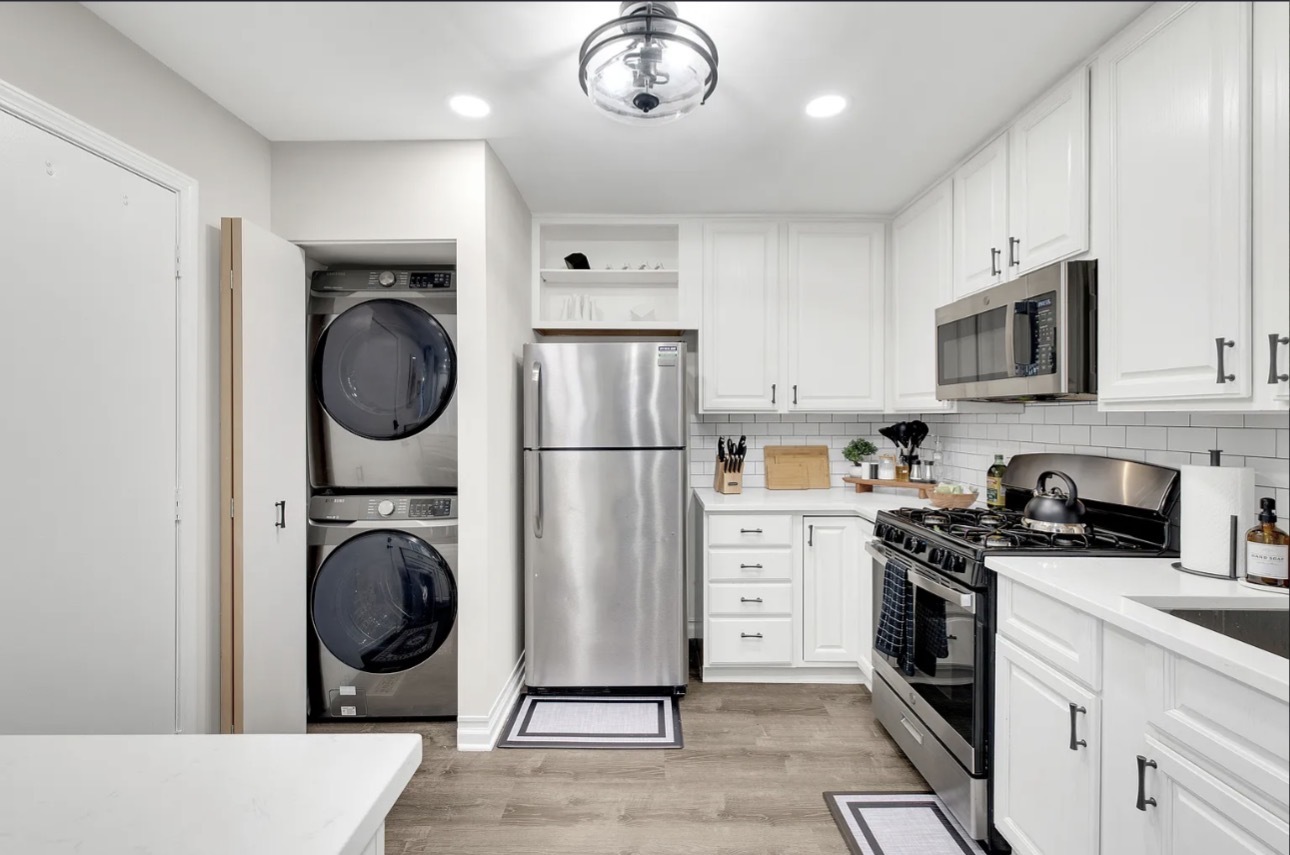 379 Sandhurst Circle, Unit 1 Glen Ellyn, IL 60137 - Photo 6 of 20 a kitchen with stainless steel appliances granite countertop a stove a refrigerator and a sink