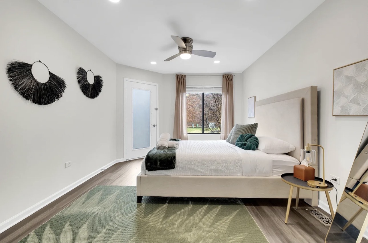 379 Sandhurst Circle, Unit 1 Glen Ellyn, IL 60137 - Photo 9 of 20 a living room with furniture and a large window