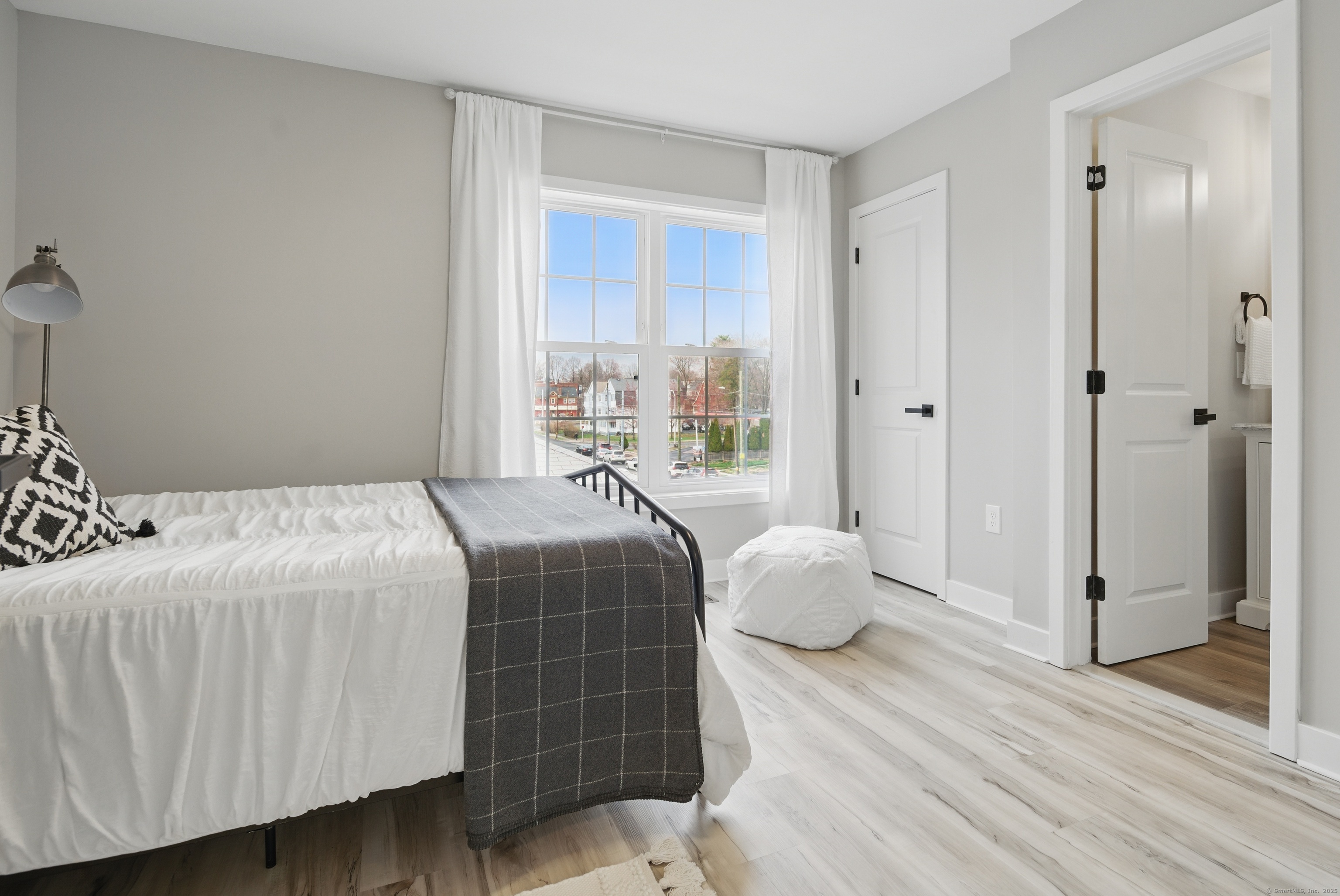 409 Prospect Avenue, Unit 5 West Hartford, CT 06119 - Photo 13 of 25 a bedroom with a beds and wooden floor