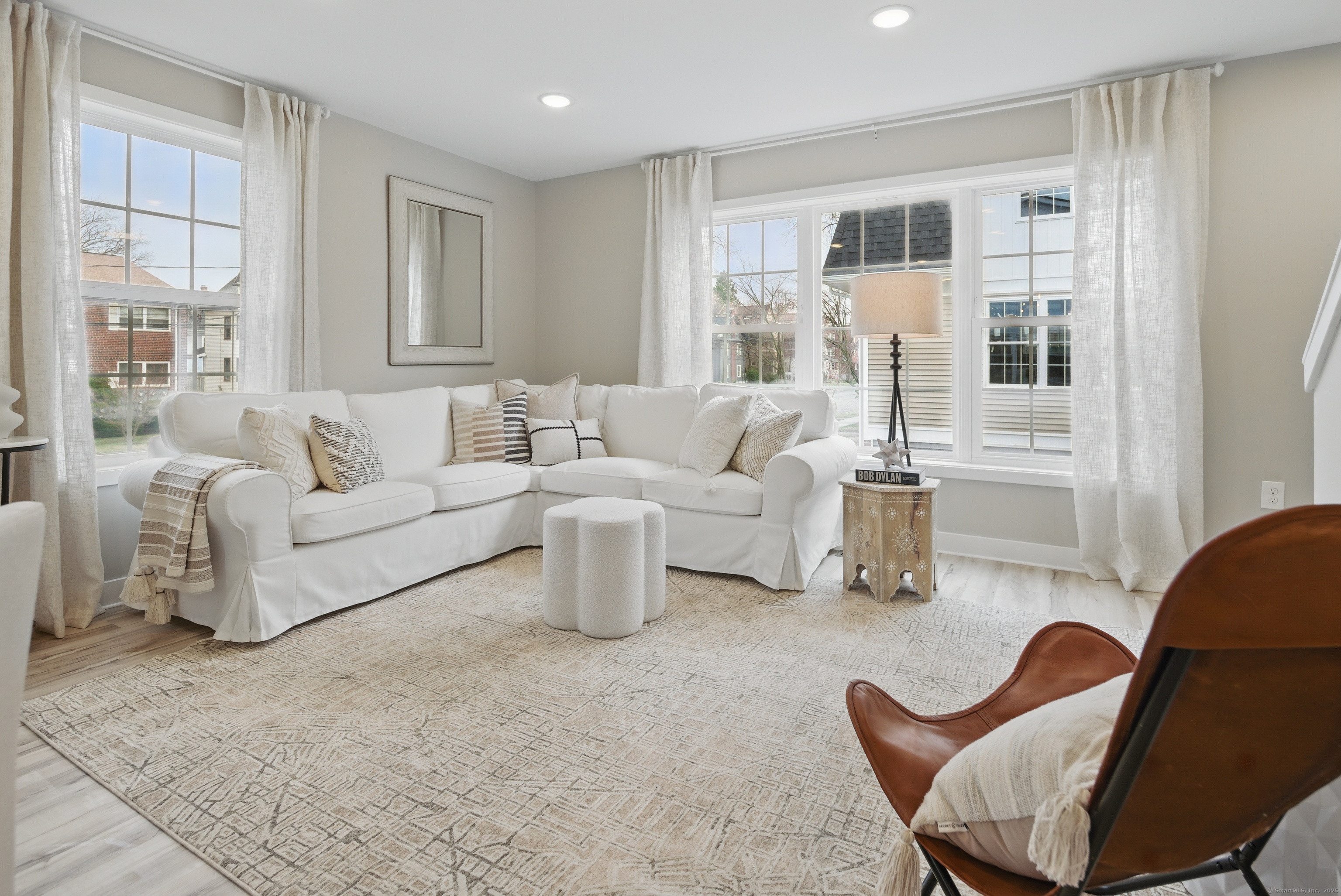 409 Prospect Avenue, Unit 5 West Hartford, CT 06119 - Photo 3 of 25 a living room with furniture and a large window