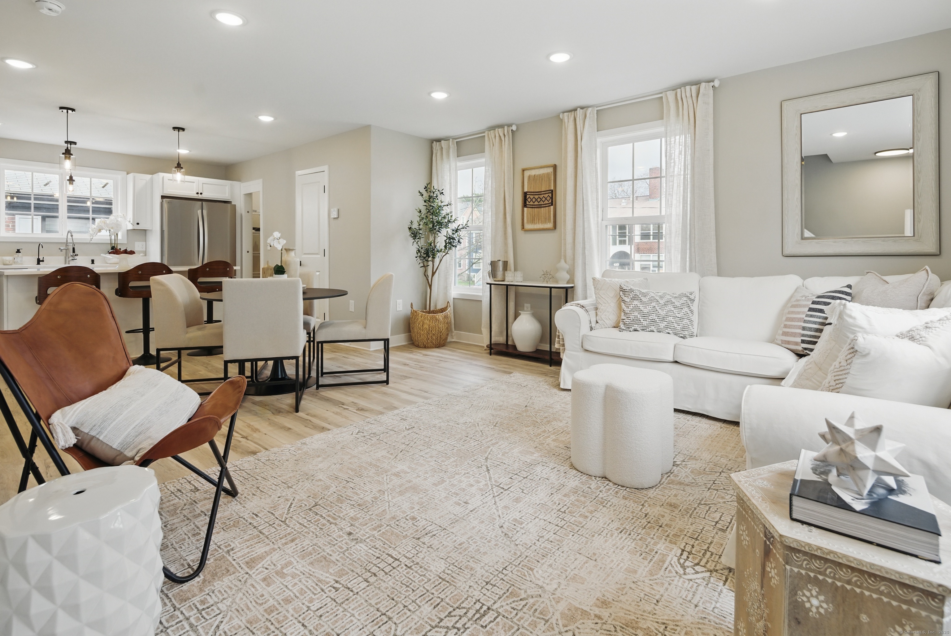 409 Prospect Avenue, Unit 5 West Hartford, CT 06119 - Photo 5 of 25 a living room with furniture and a large window