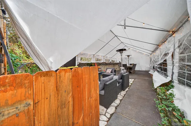 a spacious bedroom with a bed and a dresser in it