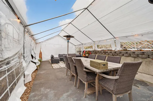 a view of a workspace room with wooden floor and window