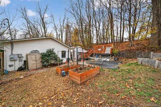 a view of a backyard with a sitting area