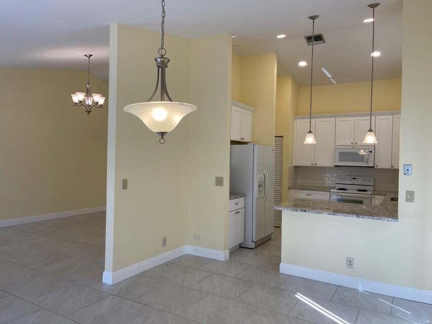 7722 Solimar Circle Boca Raton, FL 33433 - Photo 13 of 36 KITCHEN, FAMILY AND FLORIDA ROOM