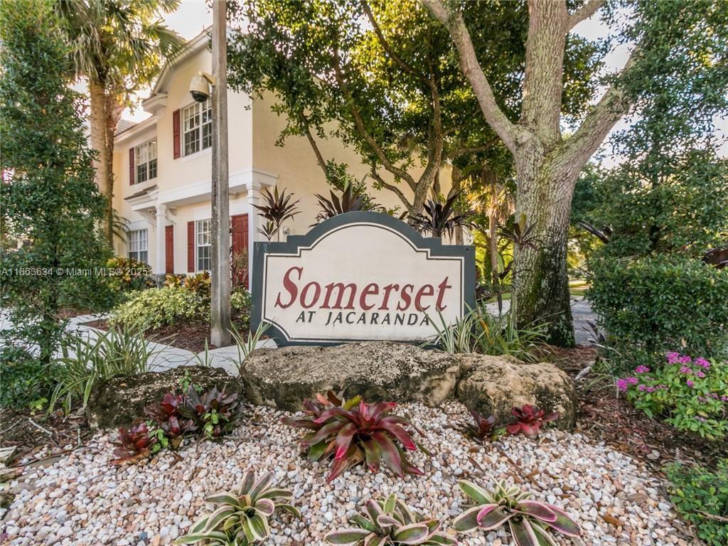 a sign that is on a brick wall