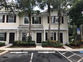 145 Southwest 96th Terrace, Unit 145 Plantation, FL 33324 - Photo 12 of 39 a front view of a house with yard