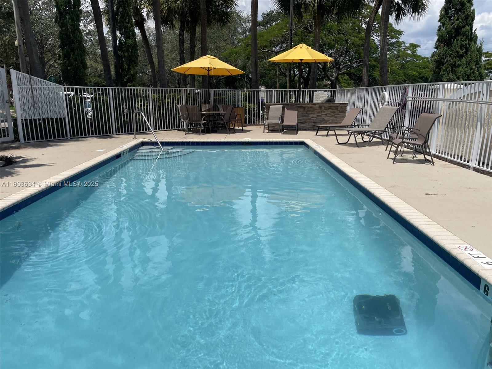 145 Southwest 96th Terrace, Unit 145 Plantation, FL 33324 - Photo 18 of 39 swimming pool view with a seating space