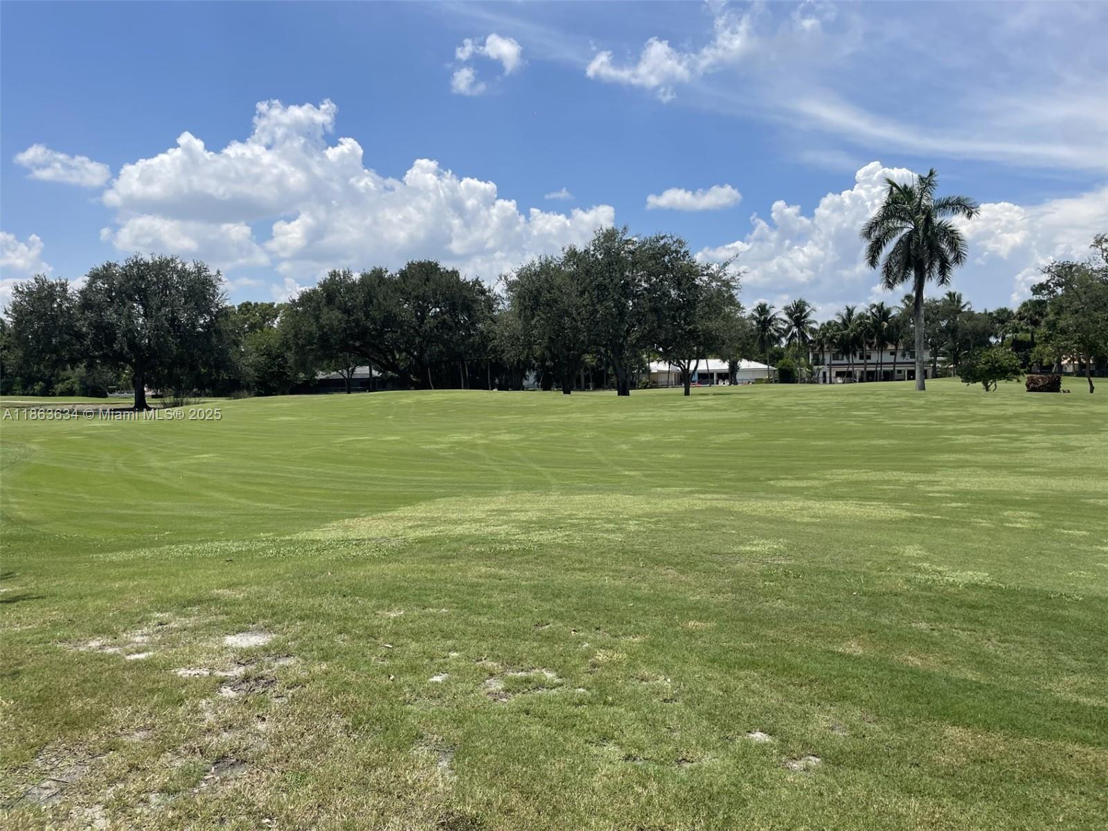 145 Southwest 96th Terrace, Unit 145 Plantation, FL 33324 - Photo 20 of 39 a view of a field with an trees in the background