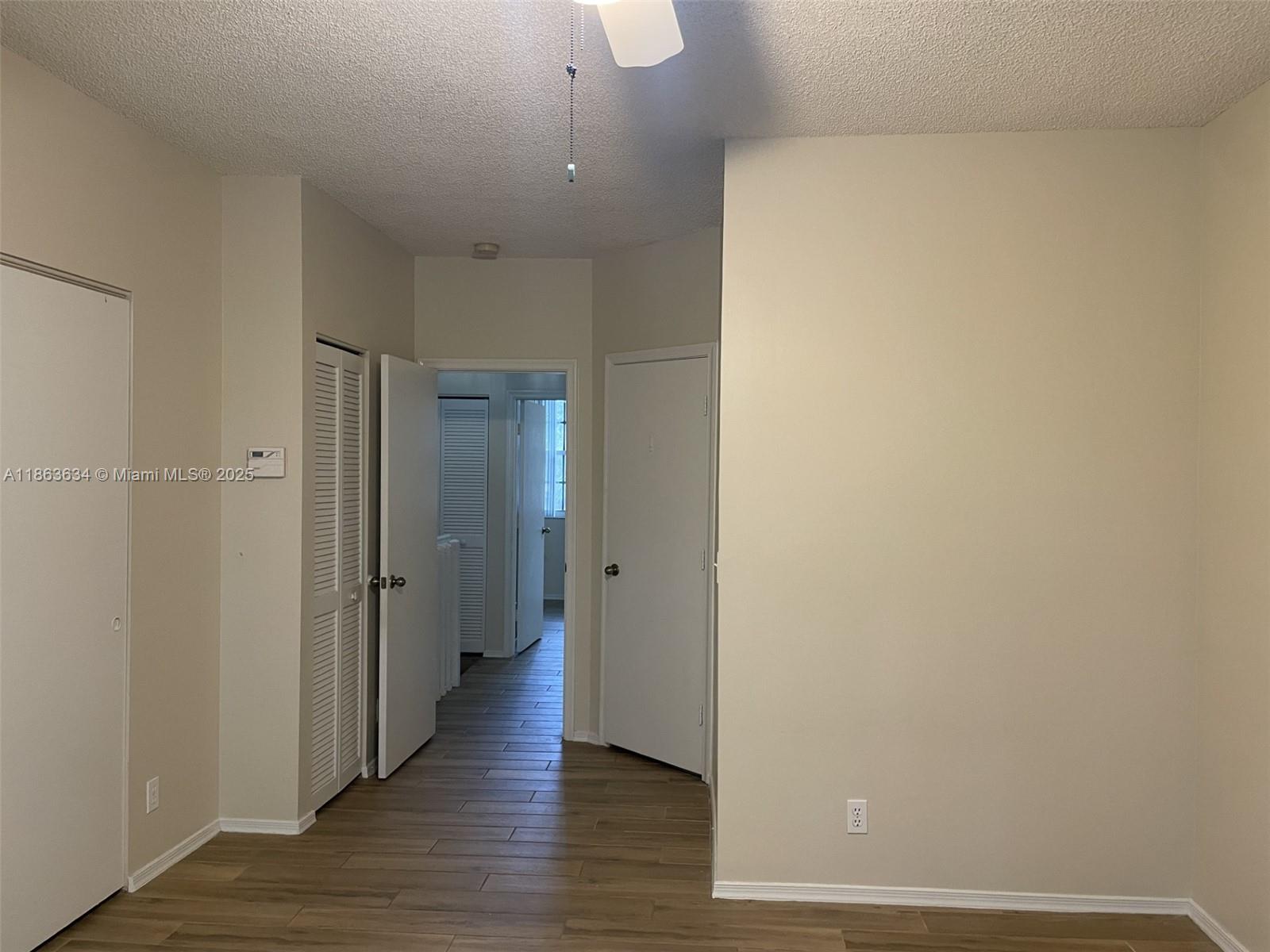 145 Southwest 96th Terrace, Unit 145 Plantation, FL 33324 - Photo 30 of 39 a view of a hallway with wooden floor