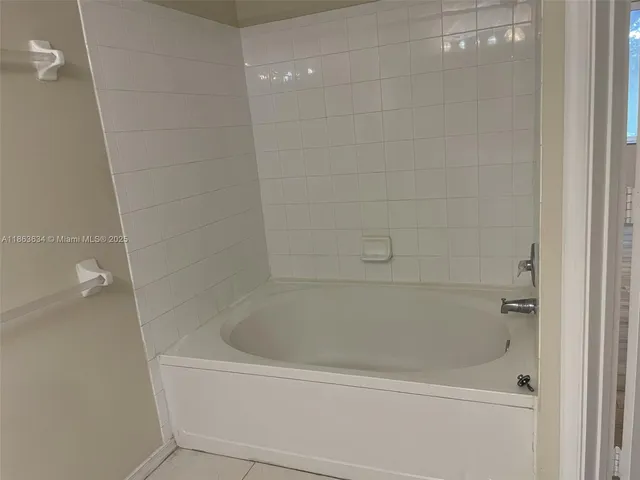 a close up of a bathtub in a bathroom