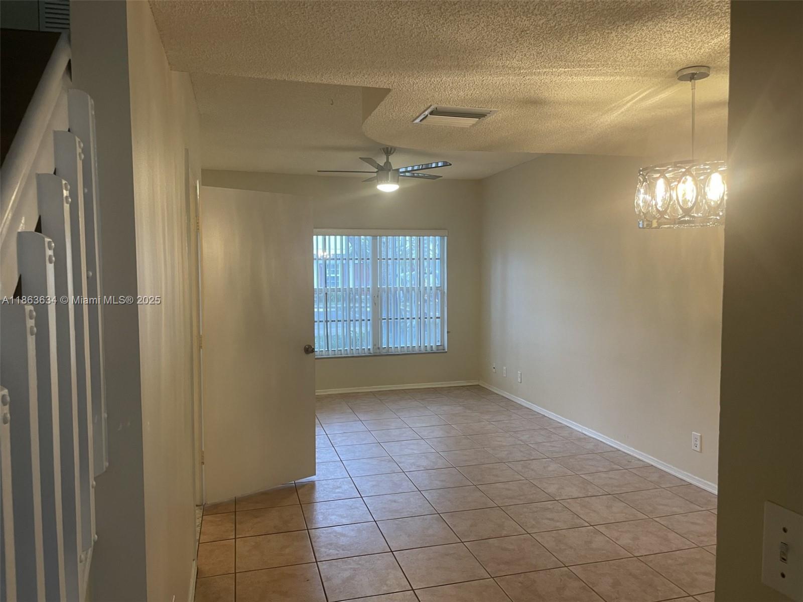 145 Southwest 96th Terrace, Unit 145 Plantation, FL 33324 - Photo 37 of 39 a view of an empty room with a window