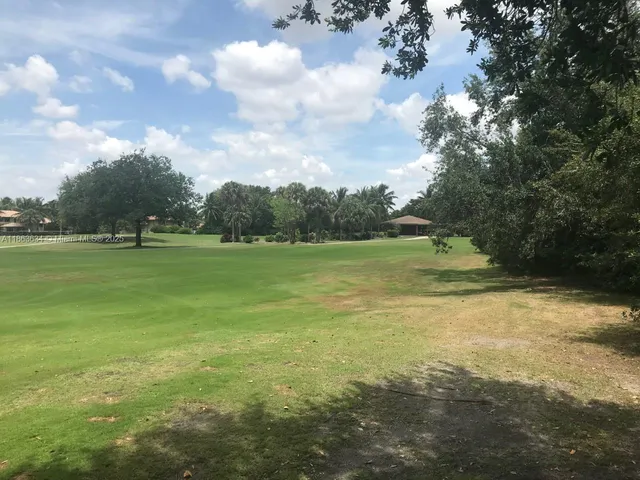 a view of a golf course with a lake